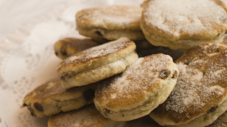 A close up of a plate of sugar dusted Welsh cakes in the restaurant at Dinefwr Park, Llandeilo, Wales